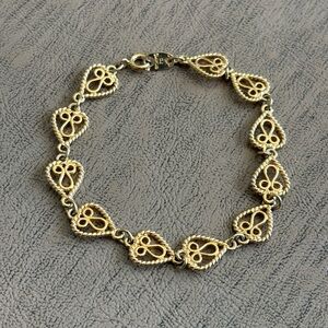 Vintage Avon "Simply Hearts" gold-tone filigree chain link bracelet.